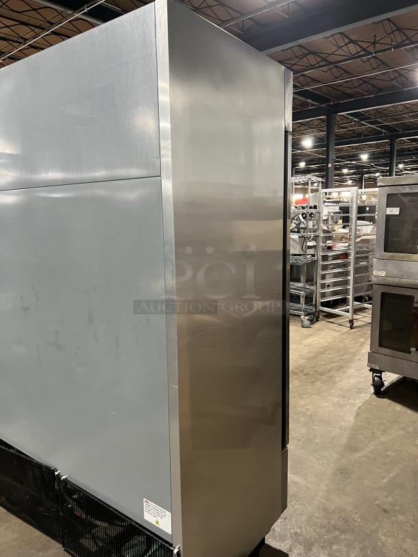 True T-49-HC commercial stainless steel 2-door refrigerator, poly-coated racks, excellent condition, on casters, 115V.