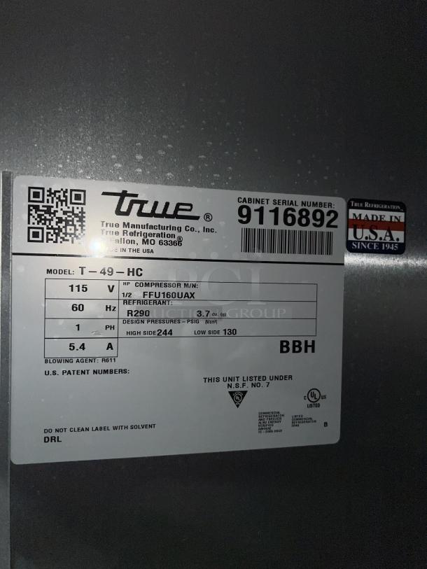 True T49HC stainless steel 2-door reach-in refrigerator, model T-49-HC, SN 9116892, 115V, on casters, poly coated rack.