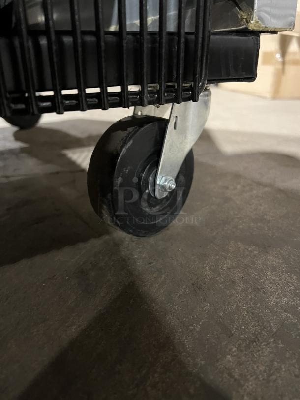 Caster wheel of a True T49HC commercial refrigerator, showing mobility feature.
