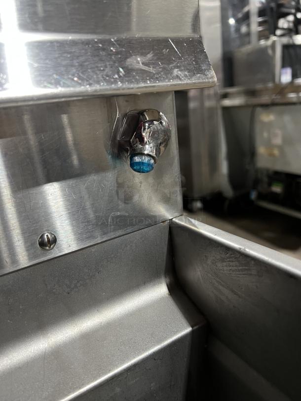 Stainless steel corner of Pitco SSPG14 pasta cooker with visible screw and bolt detail.