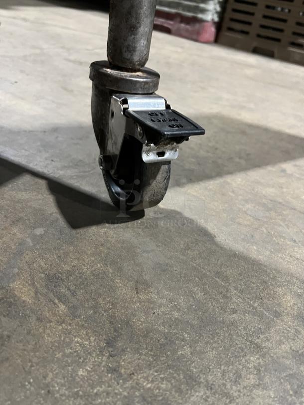 Caster wheel of Pitco Solstice Supreme Series pasta cooker, model SSPG14. Steel construction, lockable for stability.