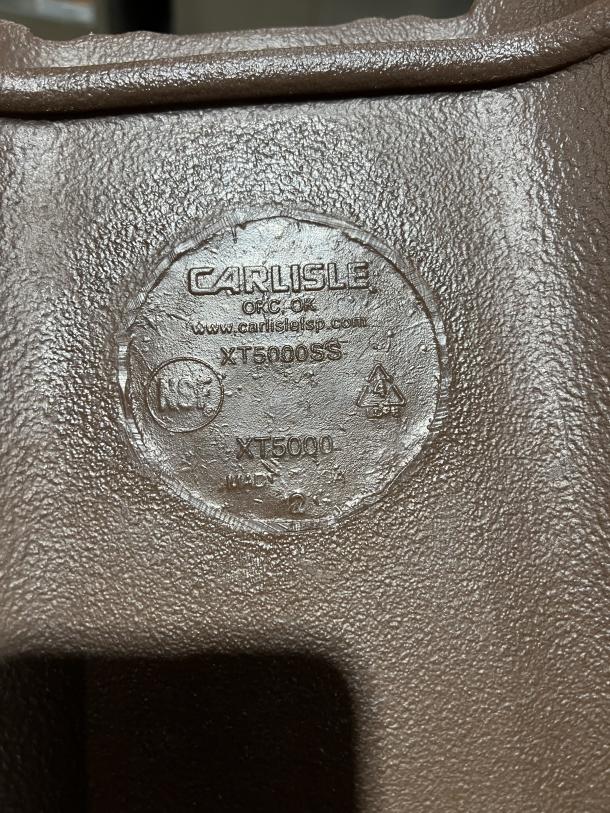 Cambro Carlisle Series brown insulated beverage dispenser, model XT5000SS, shows embossed Carlisle branding and model marking.