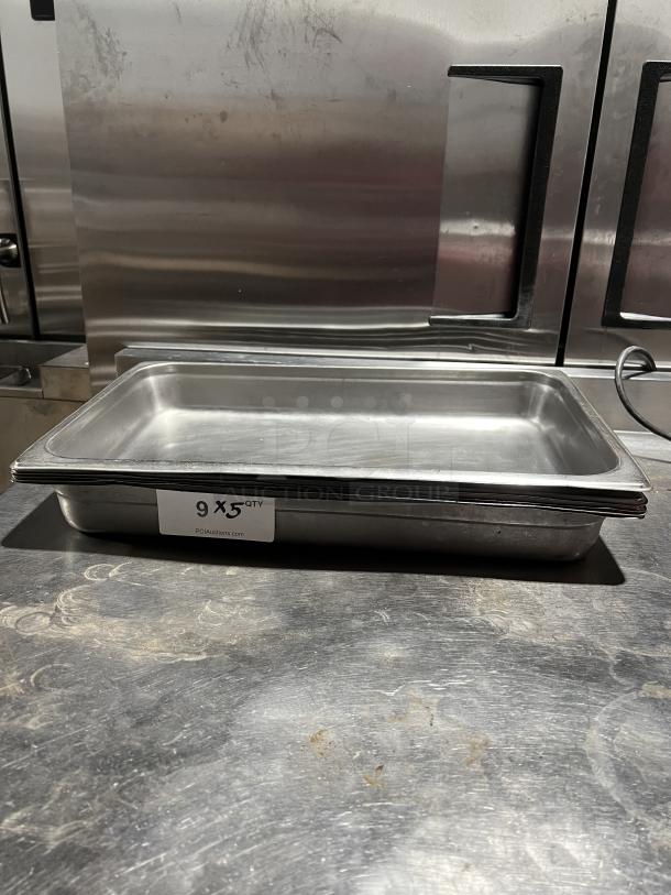 Commercial stainless steel stackable steam table pan, quantity 9, shown on a stainless surface, ideal for catering or kitchen use.