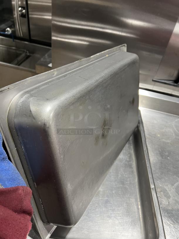 Commercial stainless steel stackable steam table pan, slightly worn. Ideal for catering, durable and functional design.