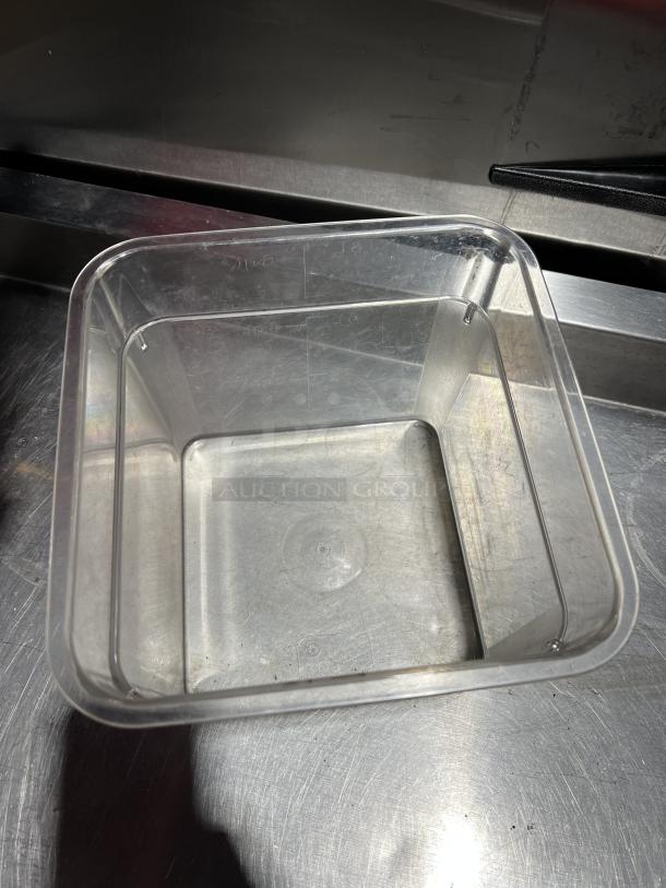 Clear polycarbonate 6 qt. food storage container, commercial grade, lightly used. Features embossed measurements on sides.