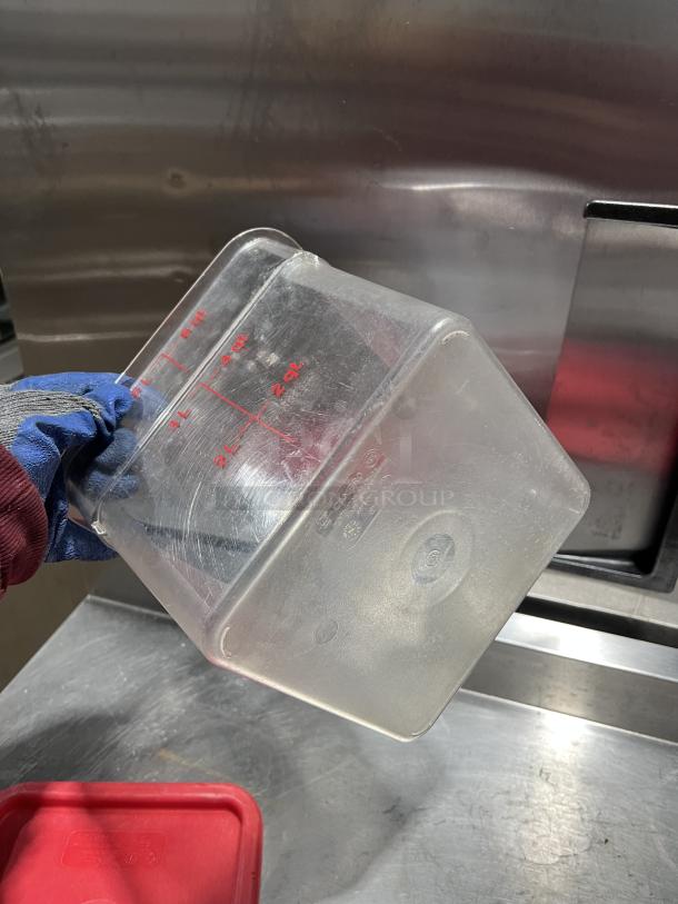 Commercial clear polycarbonate 6 qt. food storage container, measurements in quarts and liters, durable, lightly used.