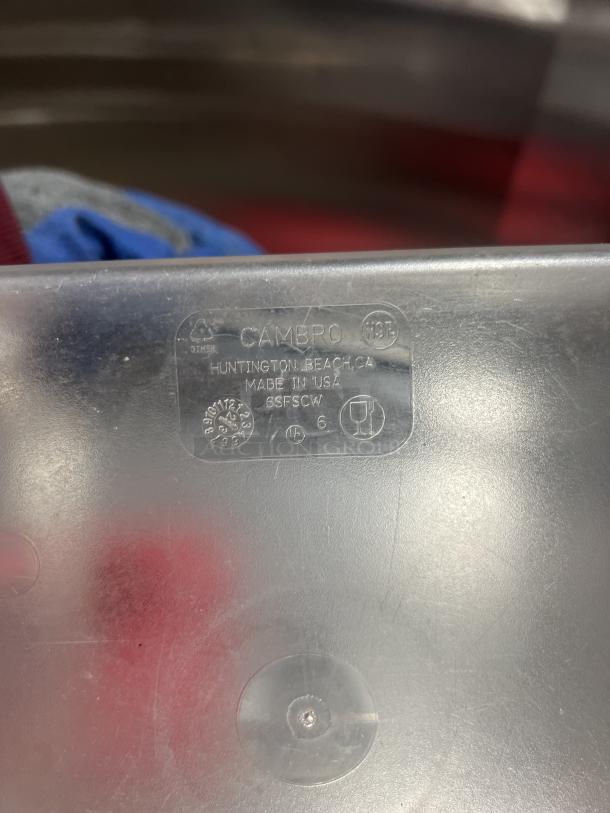 Clear polycarbonate 6 qt. Cambro food storage container, commercial grade, made in USA, durable plastic, label visible.