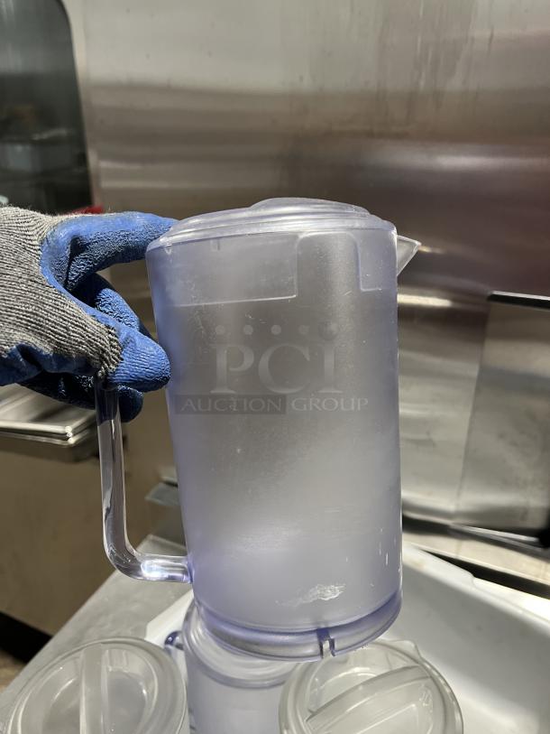 Commercial clear polycarbonate beverage pitcher, lightly frosted surface, durable handle, spout, excellent condition.