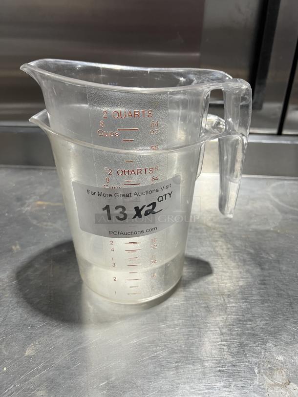 Choice Commercial 2 Qt. Measuring Cup, clear polycarbonate, red measurement markings, auction label "13 x2", good condition.