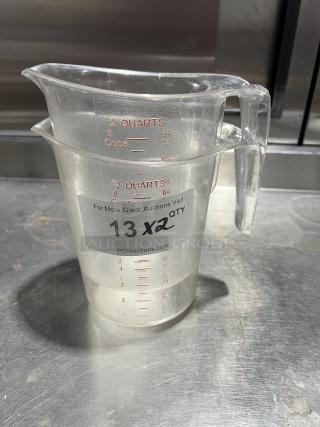 Choice Commercial 2 Qt. Measuring Cup, clear polycarbonate, red measurement markings, auction label "13 x2", good condition.