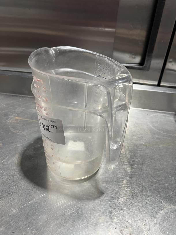 Choice commercial clear polycarbonate 2 qt. measuring cup with handle, labeled in quarts and milliliters, good condition.