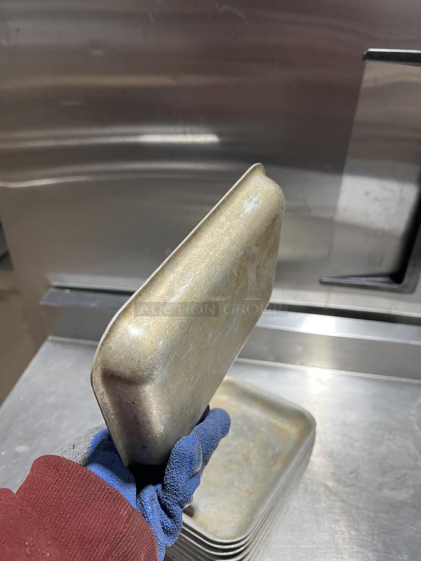 Commercial aluminum baking pan, used condition, stackable, features wear from use. Auction includes 11 pans.
