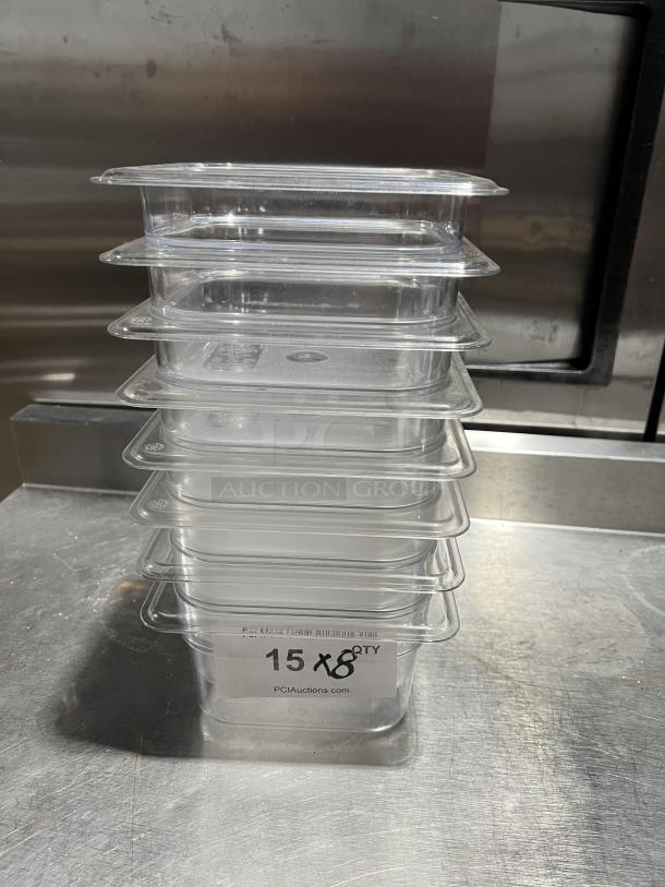 Clear polycarbonate Cambro food storage pan set, stack of 8. Excellent condition. Marked "15X8" with auction label.