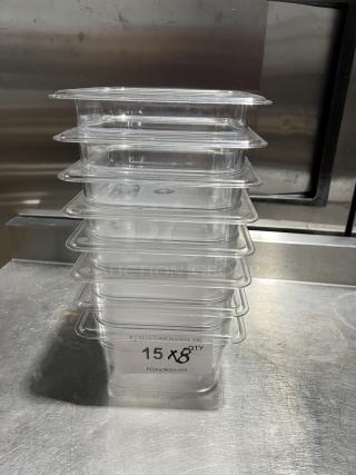 Clear polycarbonate Cambro food storage pan set, stack of 8. Excellent condition. Marked "15X8" with auction label.