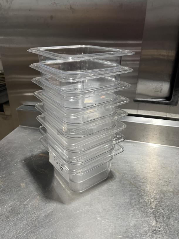 Cambro clear polycarbonate food storage pans, stack of eight. Durable, commercial quality, slightly used condition, with label markings.