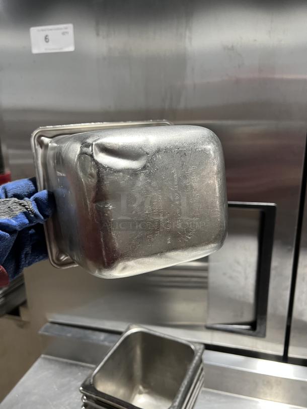 Commercial stainless steel steam table pan, visible dents, stamped with "SUPER" and specifications, lot number 6.
