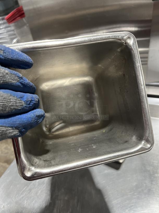 Commercial stainless steel steam table pan, gently used, showing slight wear. Compact size, ideal for catering use.