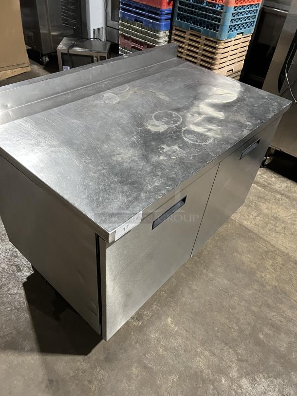 Randell Commercial 2-Door Stainless Steel Worktop Refrigerator, Model 93027, on casters. Used condition with visible surface wear.
