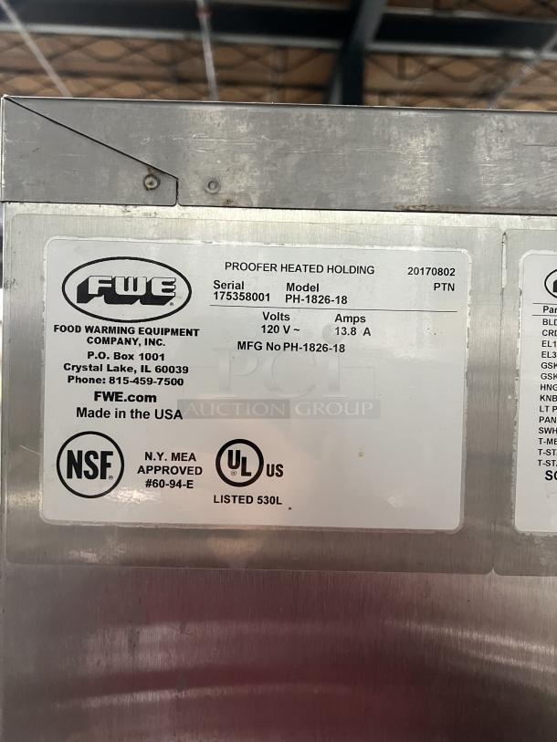 FWE stainless steel heated holding/proofing cabinet, model PH182618, with built-in pan slides, casters, and 120V power. Serial 175358001. NSF and UL listed.