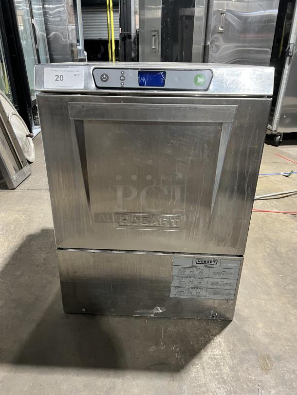 Hobart LXe Series commercial stainless steel undercounter dishwasher, electric powered, includes dish rack, visible control panel.