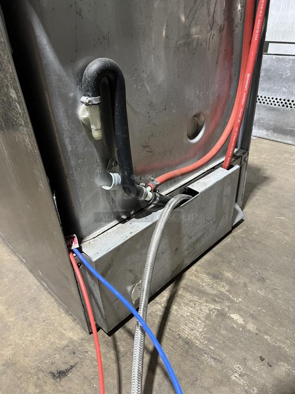 Hobart LXe commercial undercounter dishwasher, stainless steel, with dish rack, electric-powered, visible hoses, good condition.