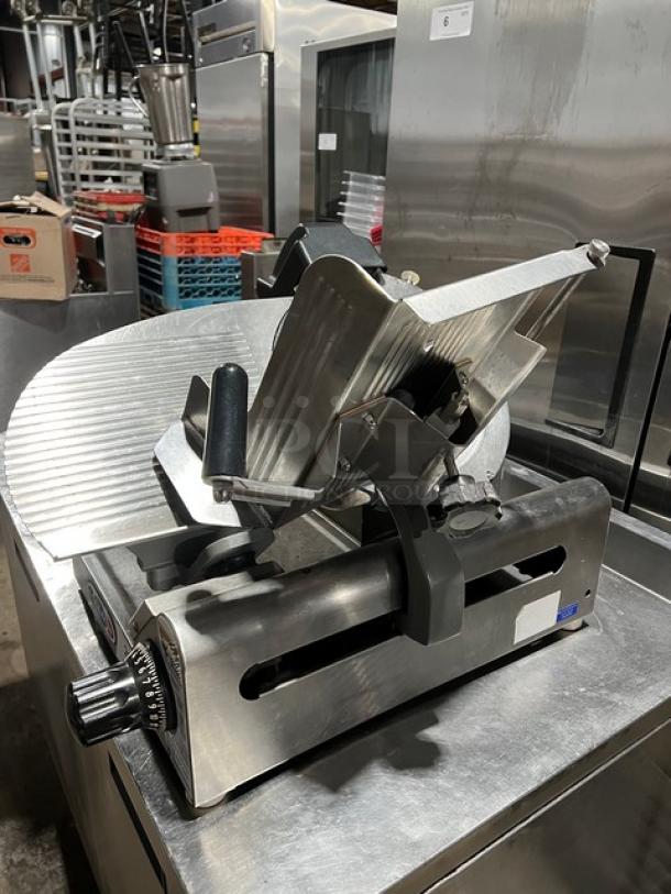 Globe commercial electric countertop meat slicer with adjustable blade and handle, on legs, stainless steel, excellent condition.