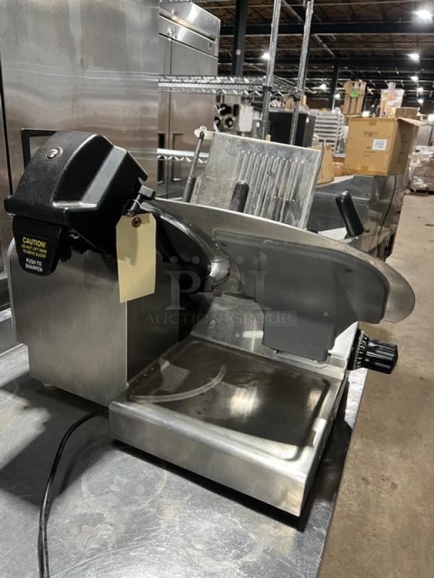 Globe commercial electric countertop meat deli slicer, on legs, features adjustable thickness dial, stainless steel construction.