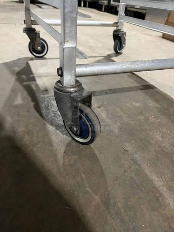 Commercial aluminum heavy-duty 20-pan sheet rack with casters; durable construction, ideal for bakeries or restaurants.