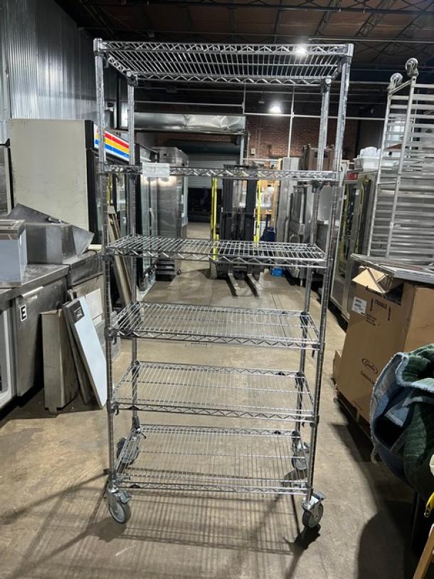 Metro Super Erecta Series multi-tier chrome storage rack on casters; commercial-grade, excellent condition.