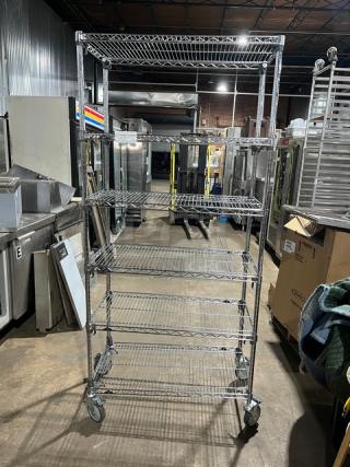 Metro Super Erecta Series multi-tier chrome storage rack on casters; commercial-grade, excellent condition.