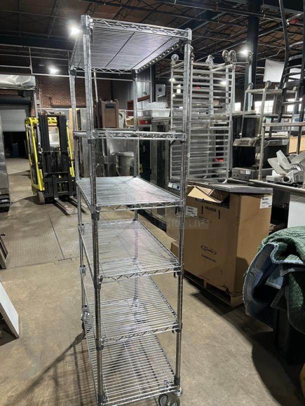 Metro Super Erecta chrome multi-tier utility rack on casters, excellent condition, ideal for commercial storage use.
