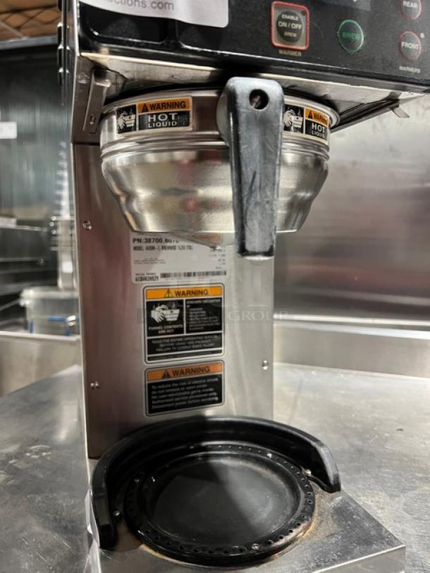 Bunn AXIOM-3 Brewwise stainless steel coffee brewer with three warming plates, heavy duty brew basket, warning labels shown.