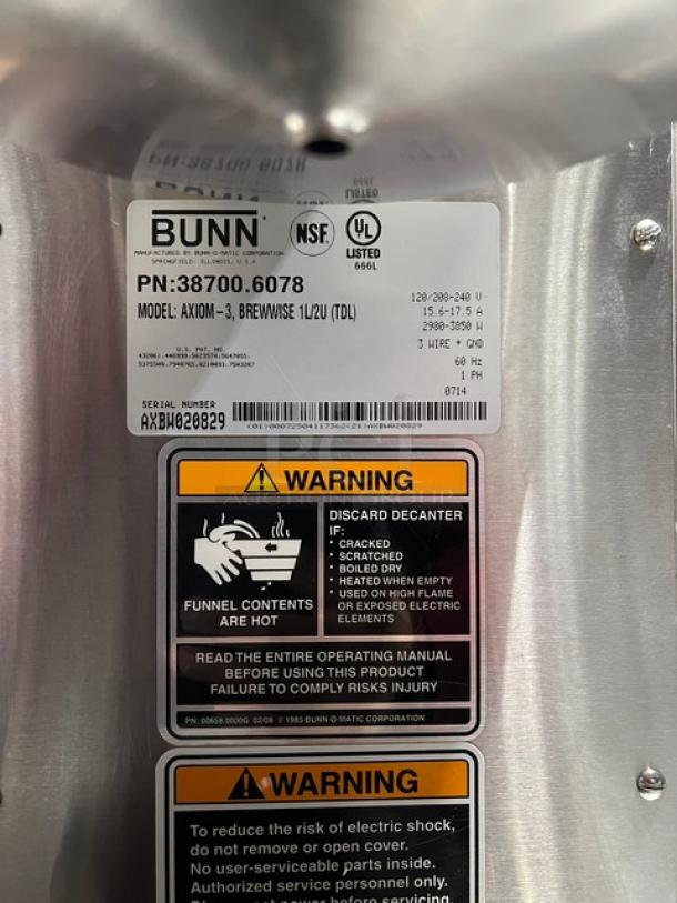 Bunn AXIOM Brewwise Series coffee brewer, model AXIOM-3, with 3 warming plates, heavy-duty brew basket, warning labels, and 120/208-240V capacity.