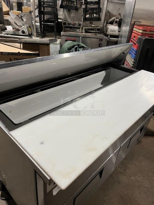 True TSSU-60-16D-4 refrigerated prep table, stainless steel, 4 drawers, 60", includes cutting board, on casters.