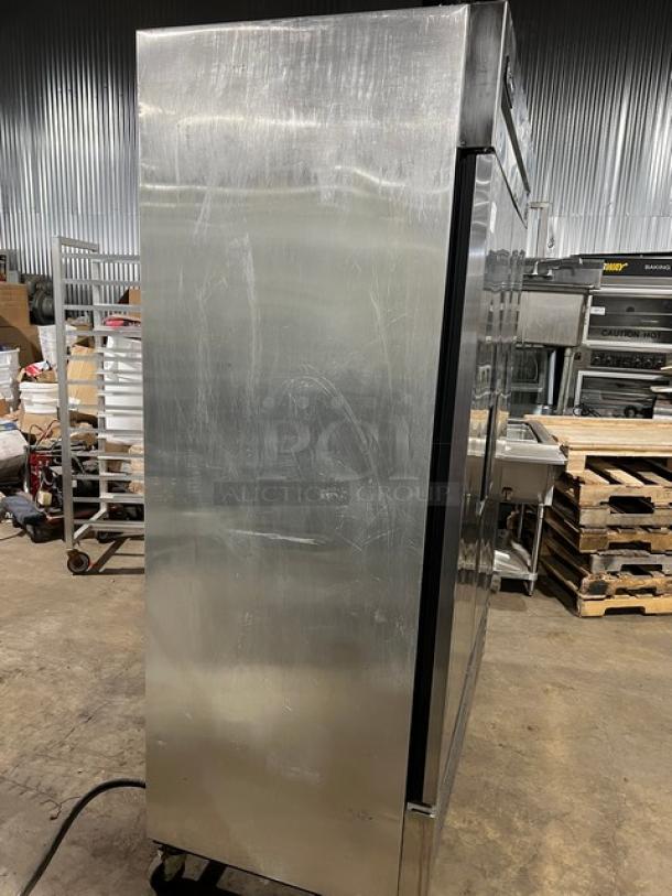 True Commercial Stainless Steel 2 Door Reach-In Refrigerator, Model T-49, with poly coated rack, on casters.