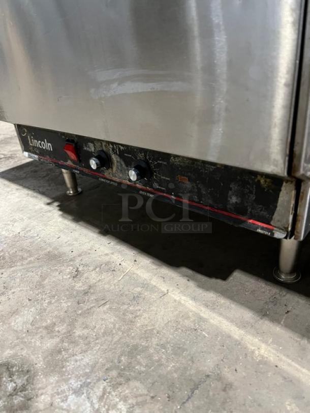 Lincoln Model 1301 countertop conveyor oven, stainless steel, electric, on legs, worn controls, 208V, 1 Phase.