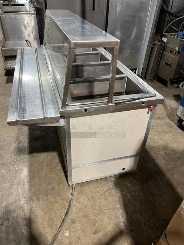 Atlas Metal custom stainless steel 4-well hot food steamtable with sneeze guard, tray slide, storage base, model WIHDM4.