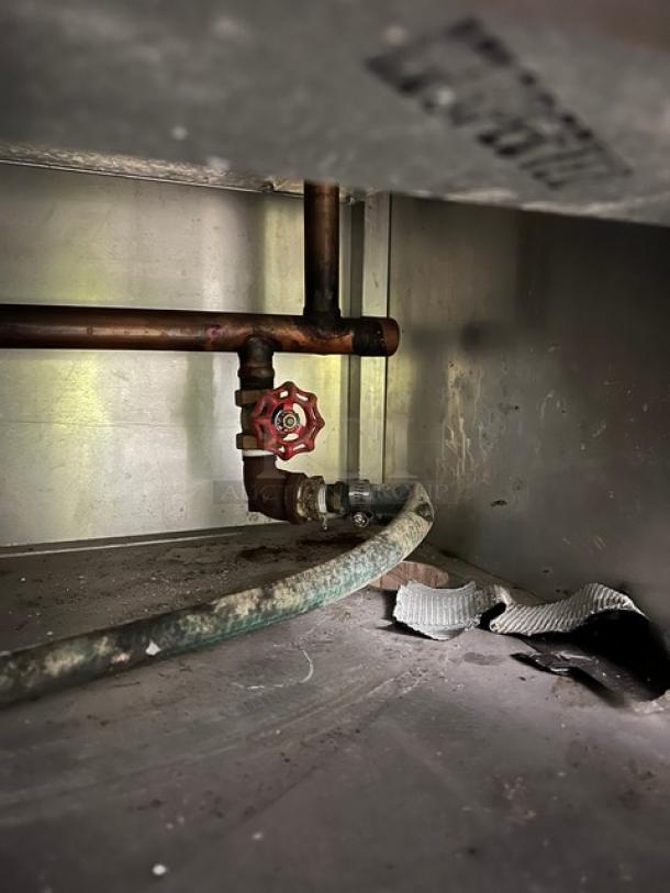 Atlas Metal Model WIHDM4 buffet steam table interior with visible piping and valve, condition slightly worn.