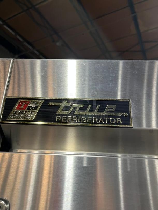 True T-23 stainless steel refrigerator, single door, solid state, with poly coated wired rack. Model T-23. Serial No. 1-3522772. 115V, 1-phase, on casters.