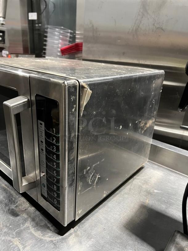 Amana RCS10TS commercial stainless steel microwave, 2021 model. Digital push controls. Used condition with surface wear. 120V.