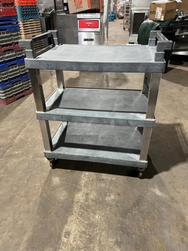 Commercial heavy-duty multi-tier utility cart on casters, three shelves, sturdy gray metal frame, used condition.