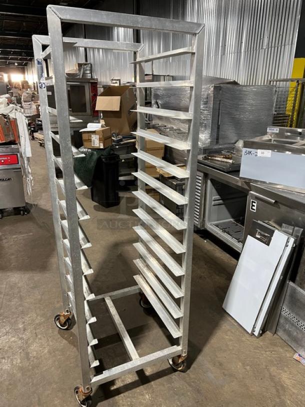 Alexander Industries commercial aluminum 12-pan sheet rack on casters in good condition, ideal for kitchens.