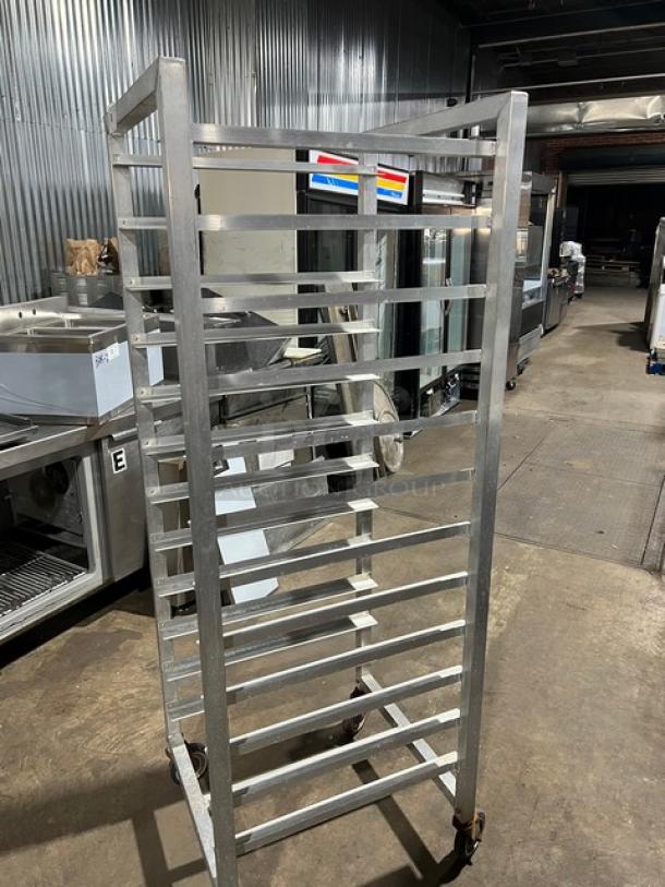 Alexander Industries commercial aluminum 12-pan sheet rack on casters, heavy-duty, used condition, ideal for bakeries.