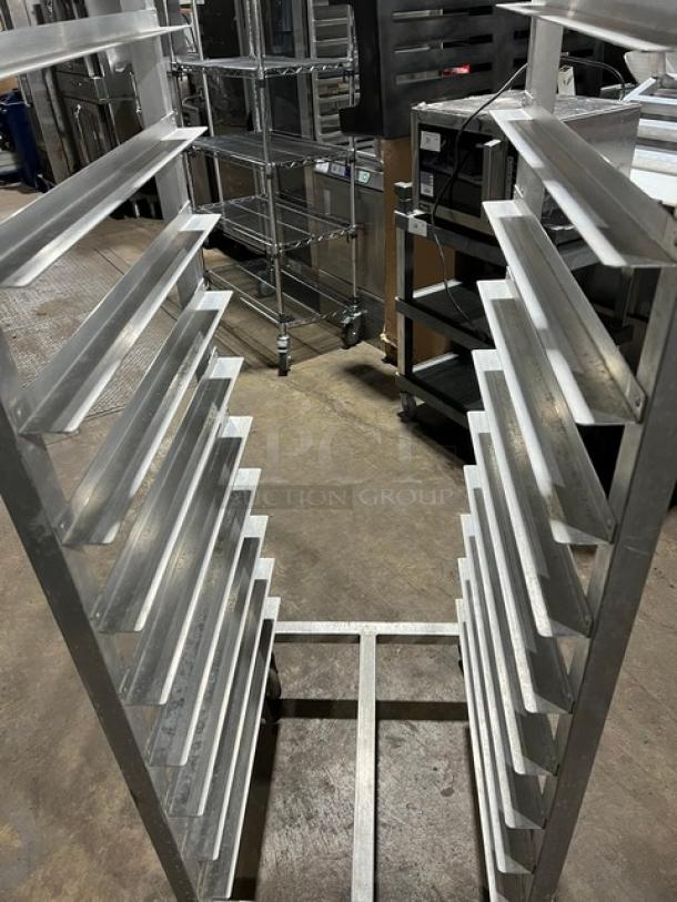 Alexander Industries commercial aluminum 12-pan rack on casters, heavy-duty design, excellent condition, ideal for bakeries.