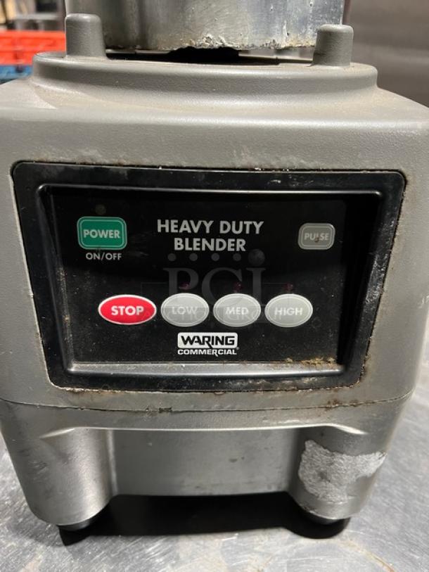 Waring Commercial CB15 heavy-duty blender, 1-gallon, stainless steel container, on legs, visible controls, used condition.