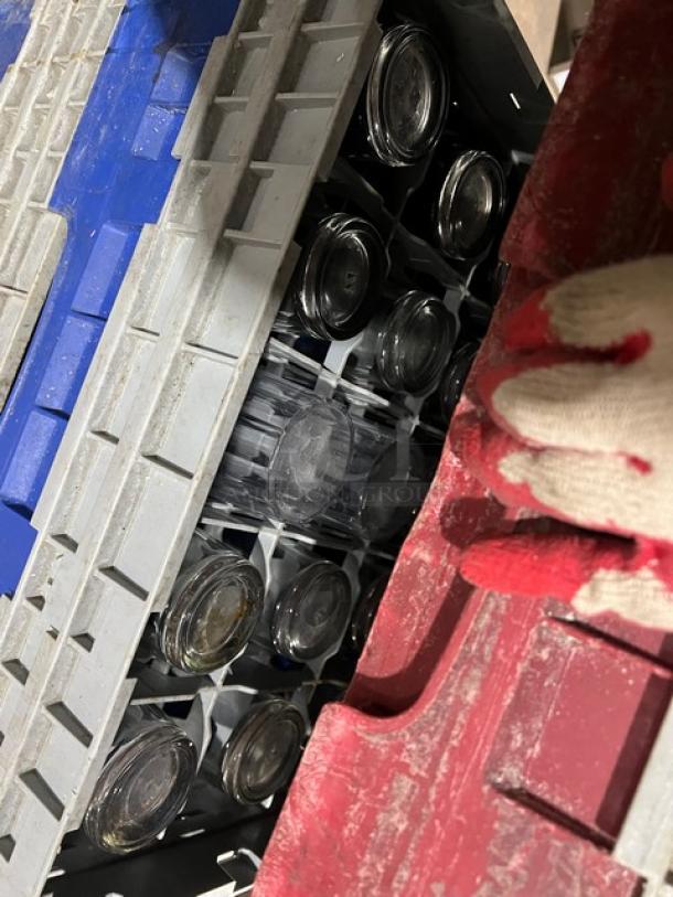 Commercial dish/cup rack with extenders, includes assorted glassware. Visible wear, durable plastic in red, blue, gray.