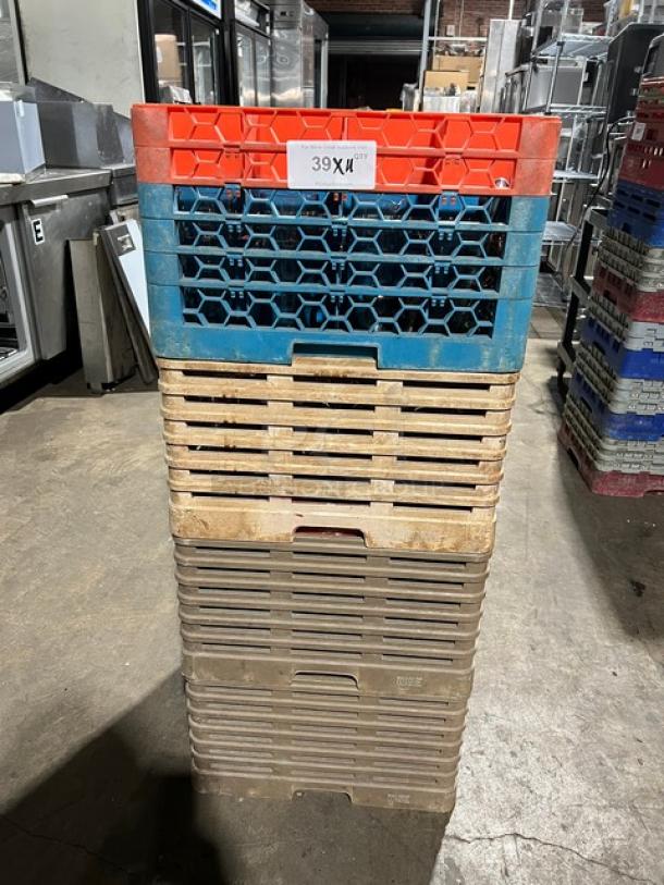 Stacked commercial dish/cup rack with extenders, mixed colors, includes assorted glassware. Visible label: "39X4". Used condition.