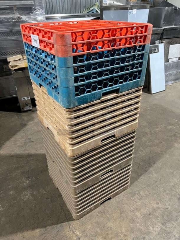 Stack of commercial dish and cup racks with extenders, assorted glassware included, used condition, labeled for auction.