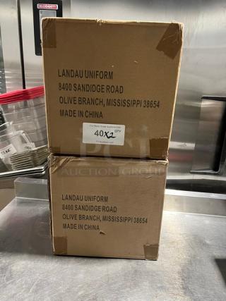 Two boxes of Landau Uniforms white non-woven 9" round chef hats. Made in China, 40 hats per box. New condition.
