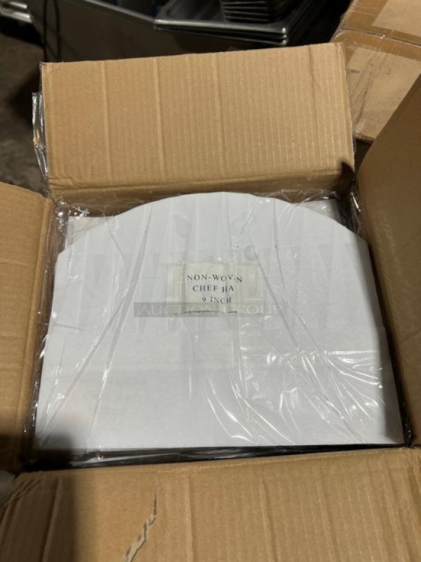 Landau Uniforms white non-woven 9" round chef hat, new in box with label showing model and size details.